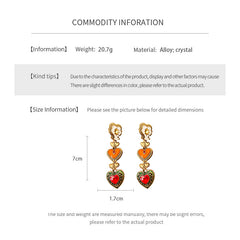Enchanted Love Drop Earrings – vintage baroque heart-shaped dangle design with gold alloy and red crystal accents, 7cm length jewelry display