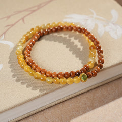 Double-strand yellow and brown beaded wrap bracelet with a small green bezel accent — Golden Harvest Wrap Bracelet Set by Glazenya.