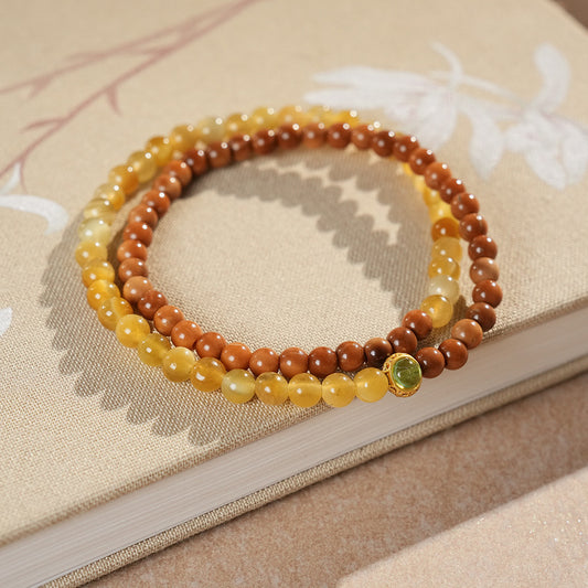 Double-strand yellow and brown beaded wrap bracelet with a small green bezel accent — Golden Harvest Wrap Bracelet Set by Glazenya.