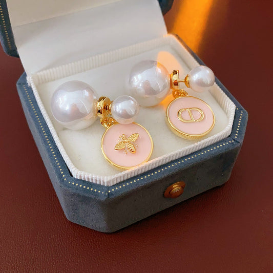 Elegant double pearl stud earrings with bee and emblem coin charms — Bee & Emblem Double Pearl Studs.