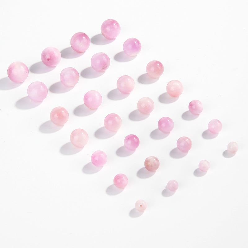 Pink-lilac kunzite round beads with silky glow, assorted 6–13 mm — Sakura Haze.