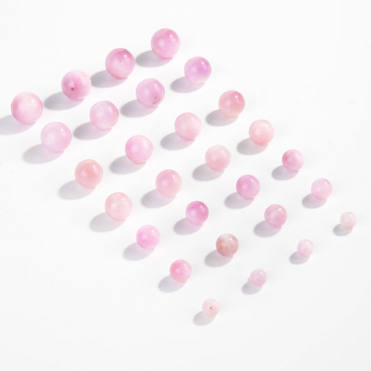 Pink-lilac kunzite round beads with silky glow, assorted 6–13 mm — Sakura Haze.