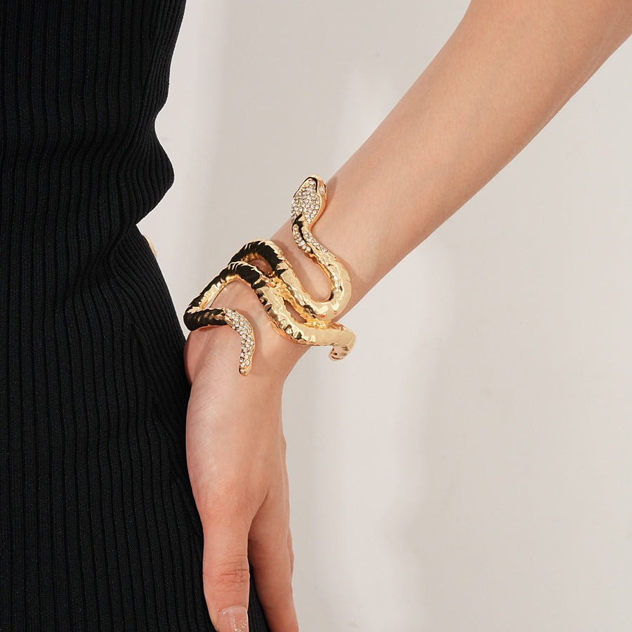 Serpent Luxe Cuff bracelet in gold and silver with rhinestone snake design