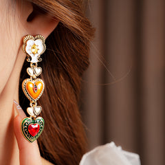 Enchanted Love Drop Earrings – vintage baroque heart-shaped dangle design with gold alloy and red crystal accents, 7cm length jewelry display
