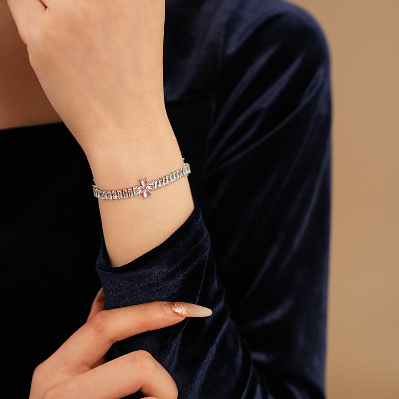 Petal Sparkle Tennis Bracelet lineup in gold and silver with pink and blue accents – baguette zircon floral design