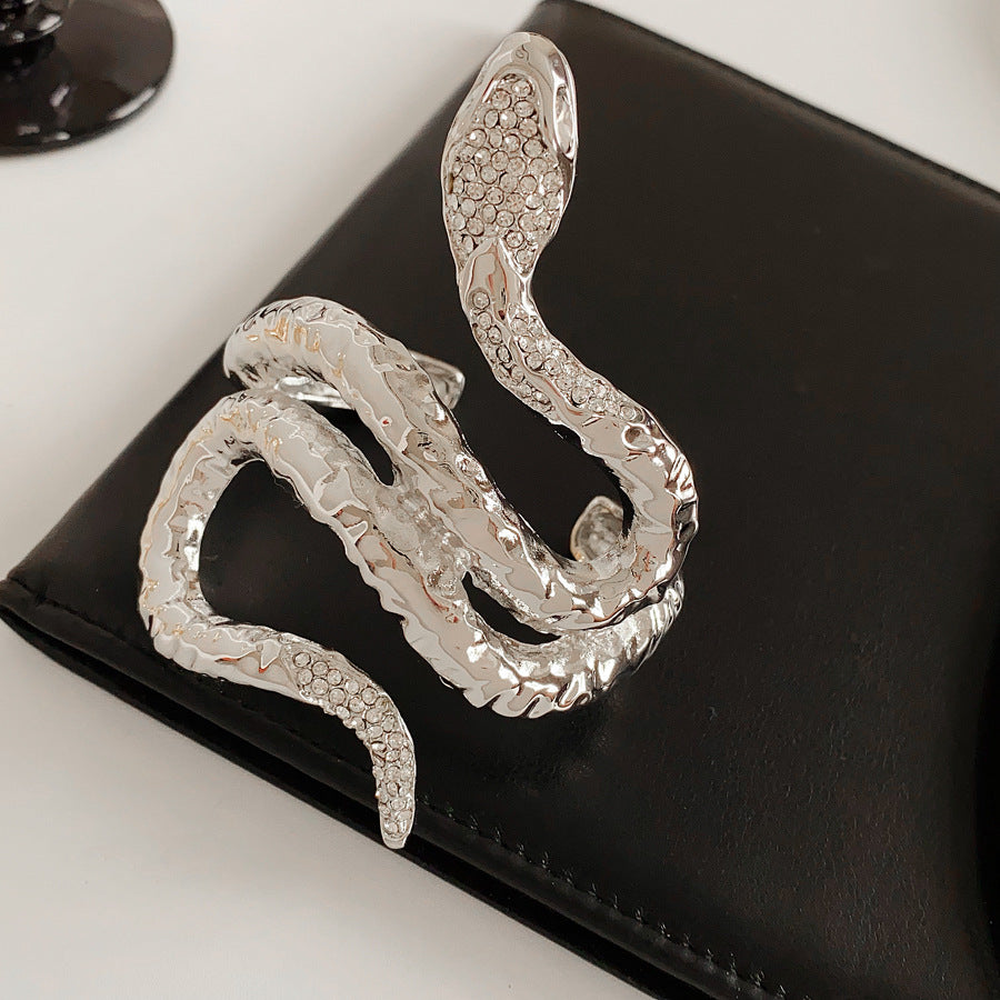 Serpent Luxe Cuff bracelet in gold and silver with rhinestone snake design