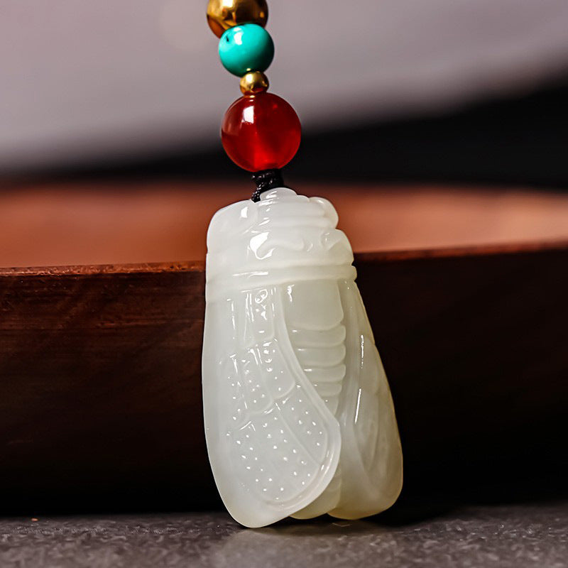 Hand-carved Hetian (nephrite) jade cicada pendant with glossy white finish — Celestial Song Hetian Jade Pendant.