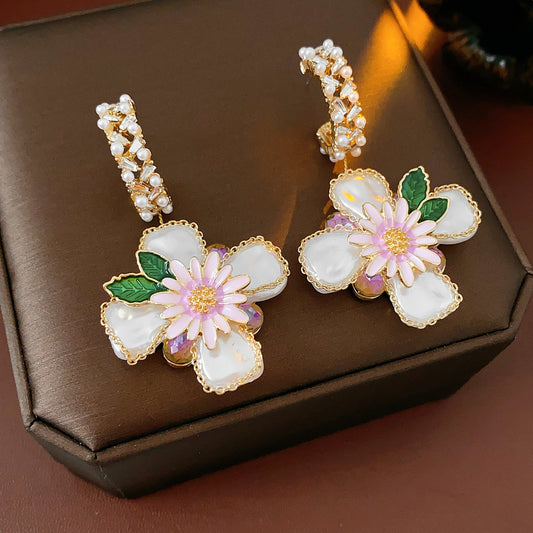 Romantic floral statement earrings with pink blossoms, imitation pearls, and enamel petals — Blossom Pearl Garden Earrings.