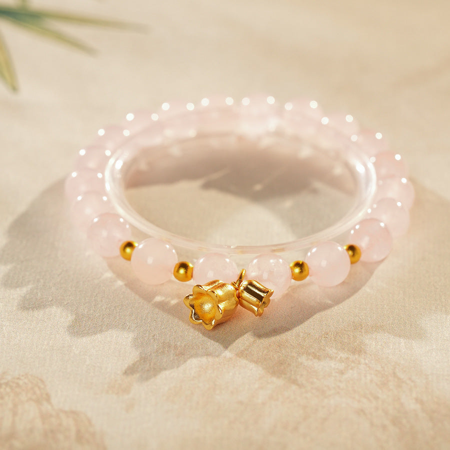 Natural amethyst beaded bangle with gold-tone accents and a lucky charm (Floral or Gourd) — Violet Fortune Amethyst Bangle.