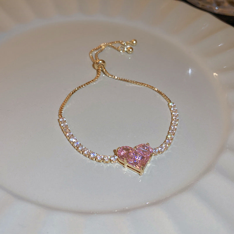 Gold-plated bracelet collection with pearls, cat’s eye stones, and floral motifs