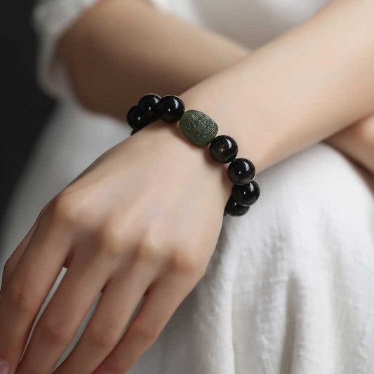 Serene Aegis – Obsidian & Hetian Jade Birth Buddha