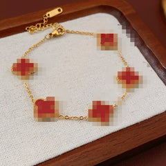 Red enamel clover bracelet with zircon accents and gold tone chain – Glazenya