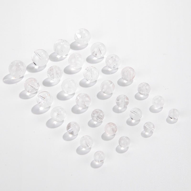 Clear quartz crystal rounds with white phantom inclusions and faint rainbow flash — Frostbow Atrium (7–14 mm).