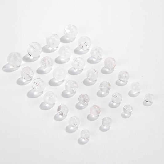 Clear quartz crystal rounds with white phantom inclusions and faint rainbow flash — Frostbow Atrium (7–14 mm).