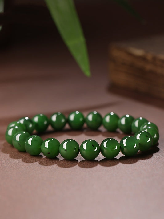 Deep green Hetian (nephrite) jade bracelet with polished round beads — Verdant Fortune Hetian Jade Bracelet.