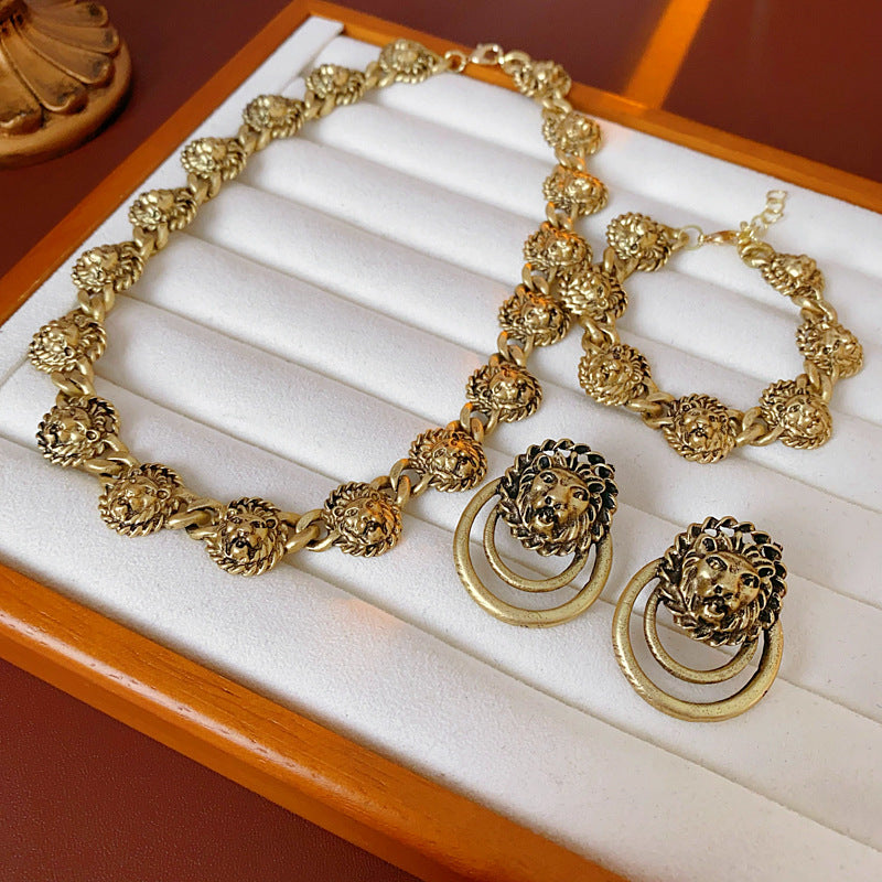 Vintage inspired lion medallion necklace and bracelet set in gold tone alloy with bold relief details