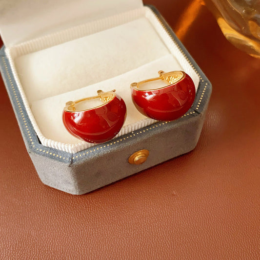 Cherry-red enamel dome huggie hoop earrings with gold tone finish — Cherry Lacquer Dome Huggies.