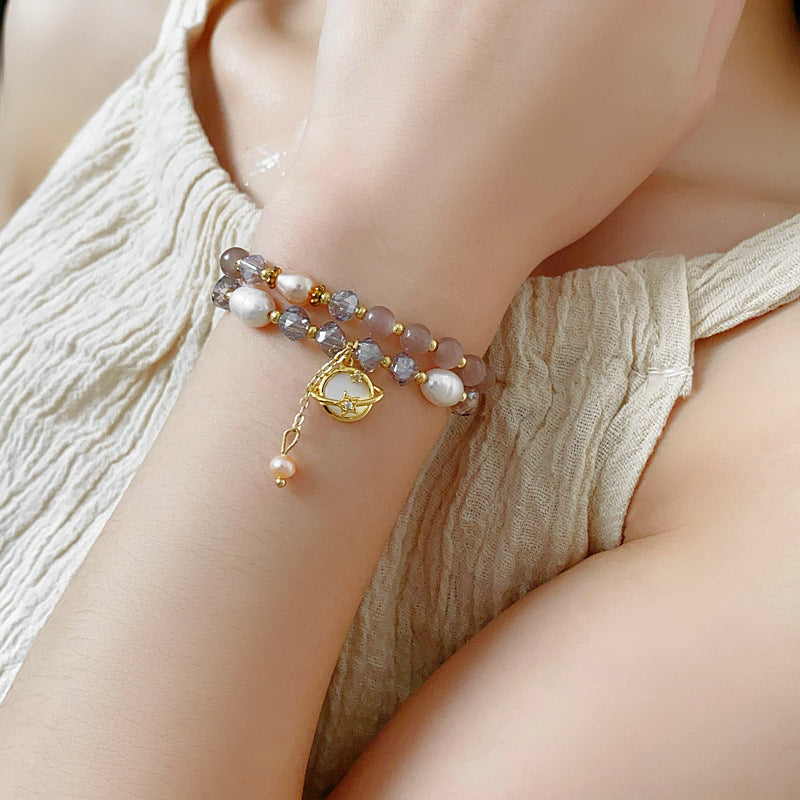 Celestial Cat’s Eye Bracelet double strand with cat’s-eye stones, freshwater pearls, crystal beads and gold planet charm