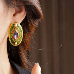 Antique-gold oval earrings with marquise purple crystal, olive rhinestones, and pearl accents — Byzantine Marquise Pearl Oval Earrings.
