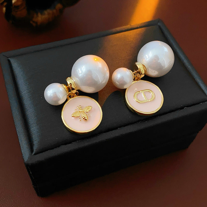 Elegant double pearl stud earrings with bee and emblem coin charms — Bee & Emblem Double Pearl Studs.