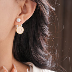 Elegant double pearl stud earrings with bee and emblem coin charms — Bee & Emblem Double Pearl Studs.