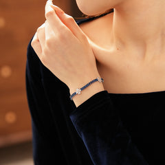 Petal Sparkle Tennis Bracelet lineup in gold and silver with pink and blue accents – baguette zircon floral design