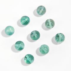 Watery mint-green fluorite round beads with translucent swirls — Mint Spring.