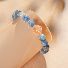Natural blue crystal bracelet featuring a red flower bead centerpiece — Azure Dawn Crystal Bracelet by Glazenya.